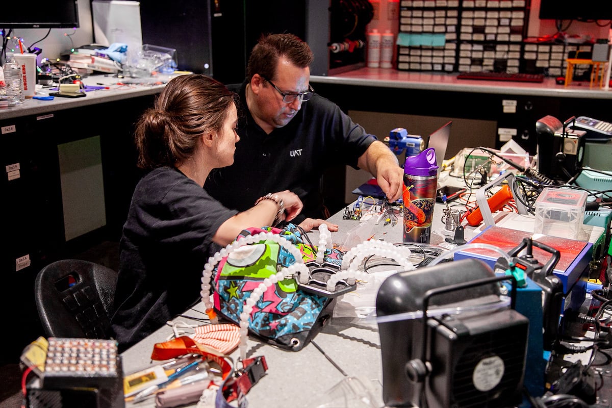 UAT Student and Professor Working in Engineering Lab